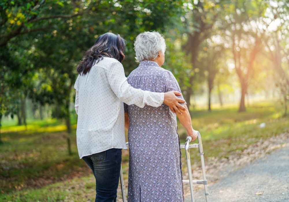 asian-senior-woman-use-walker-in-park asian-senior-woman-use-walker-in-park